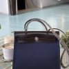 Navy with (dark brown leather)